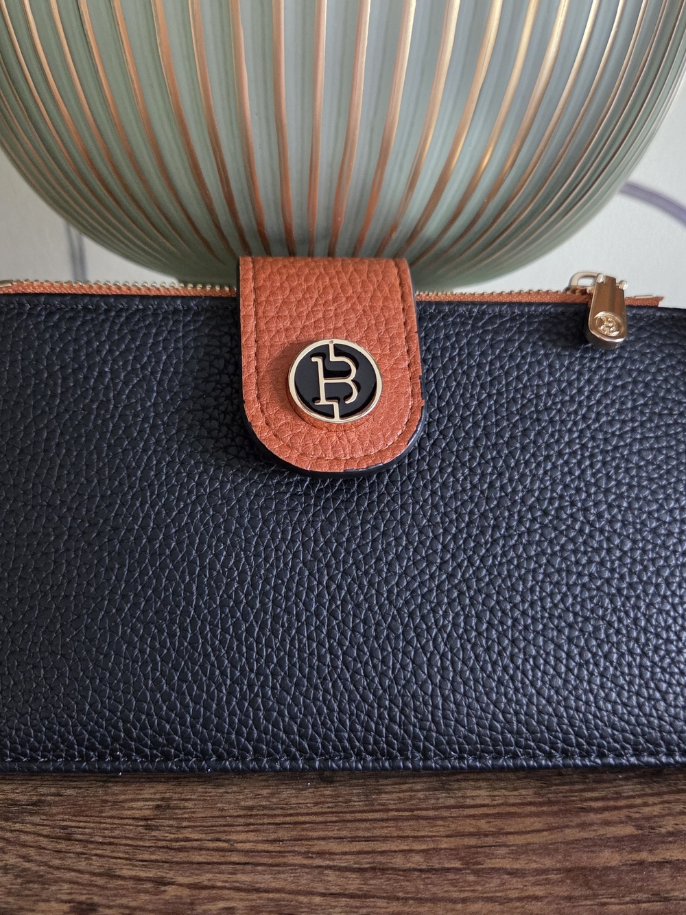 Pebbled Black Wallet with Brown Tab and Gold Accent